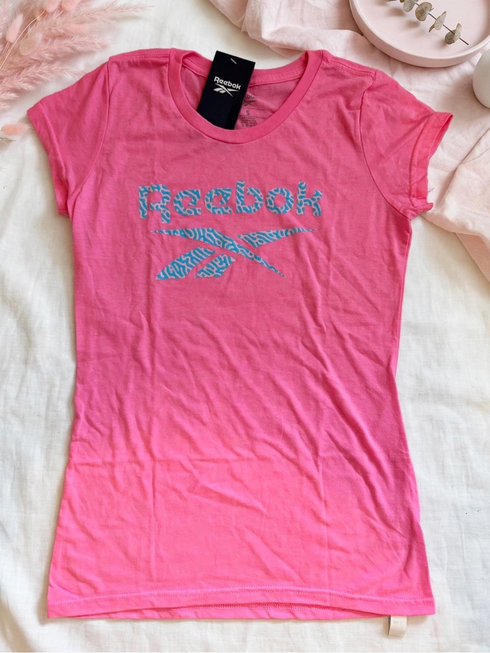 Reebok Pink Tee with Blue Logo Pattern